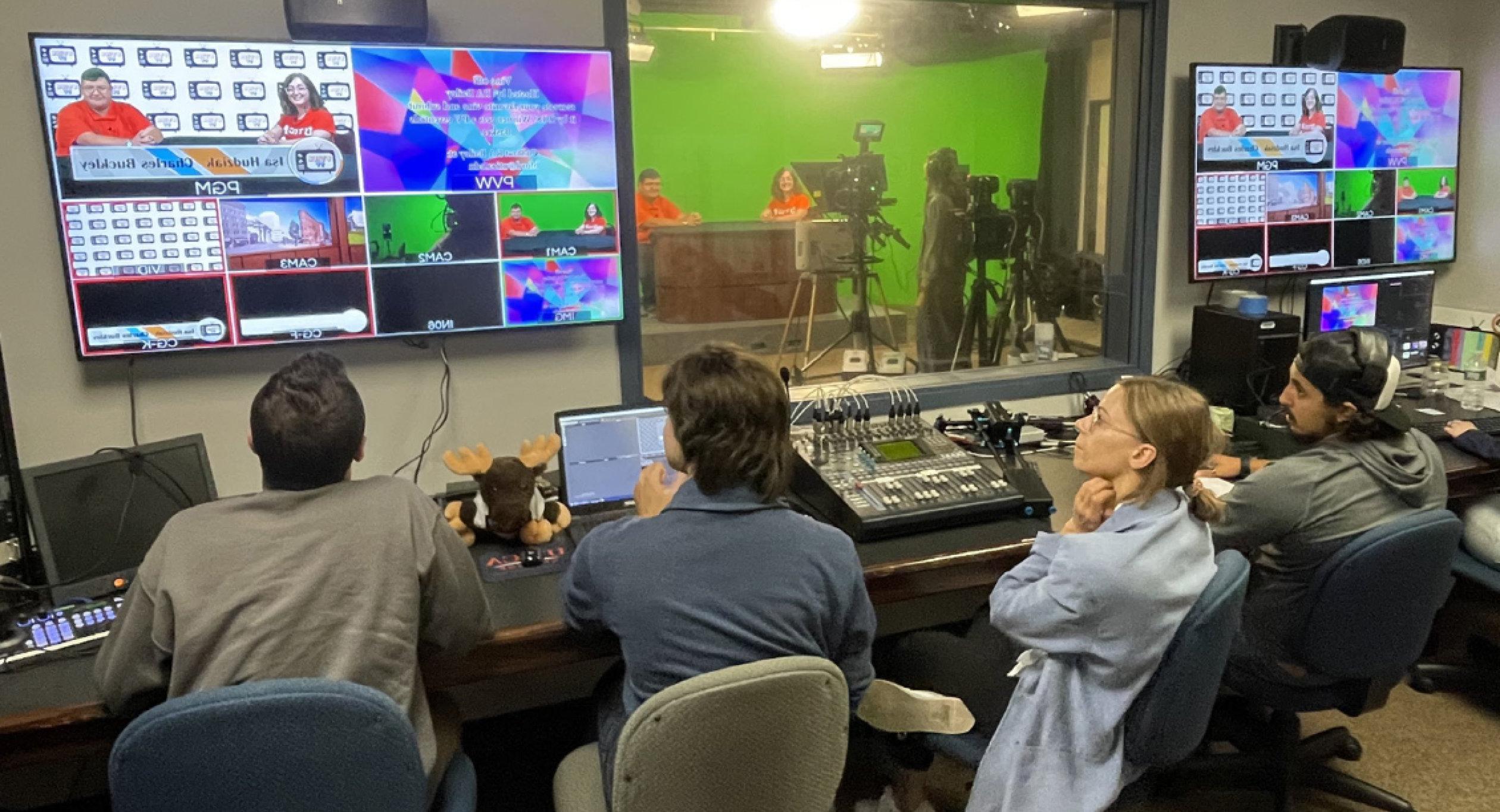 Students in control room producing a TV broadcast program.