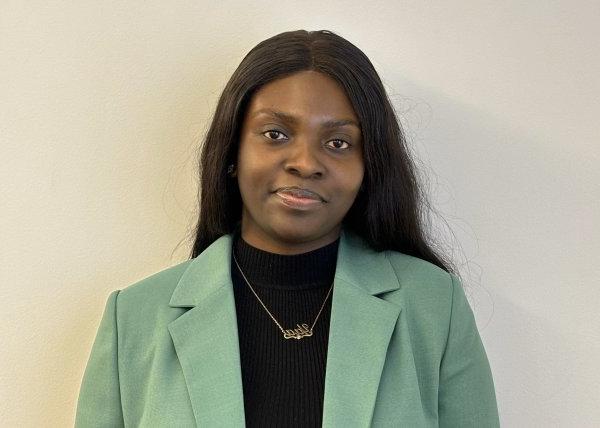 Maame Yaa Boakye, Class of 2020, in black shirt and green jacket.